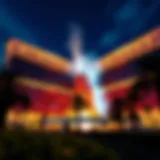 A stunning view of the Mirage Resort and Casino exterior showcasing its iconic volcano feature at night.